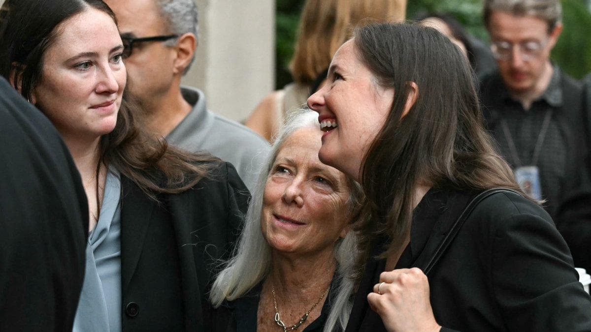 Patrice Failor (C), wife of former FBI director James Comey, walks with daughters Maurene Comey (R) and Claire Comey (L)